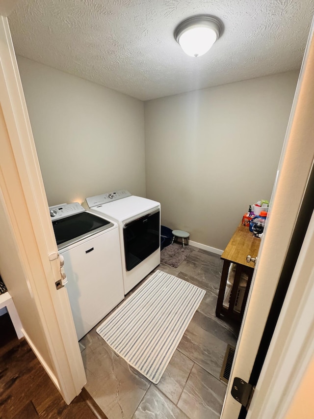 607 E Selby Dr, Nixa, MO 65714 - laundry room with washer and dryer and a textured ceiling