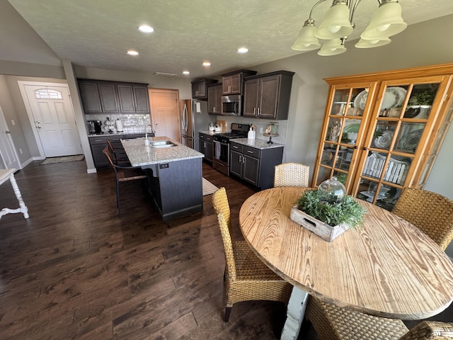 607 E Selby Dr, Nixa, MO 65714 - dining space with a chandelier, recessed lighting, dark wood-type flooring, and a textured ceiling