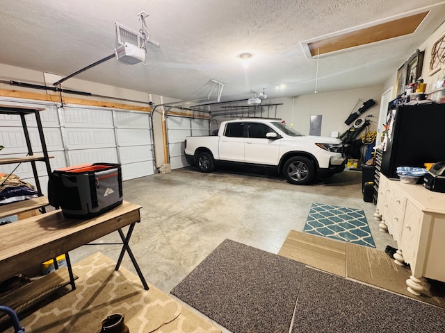 607 E Selby Dr, Nixa, MO 65714 - garage with a garage door opener and electric panel
