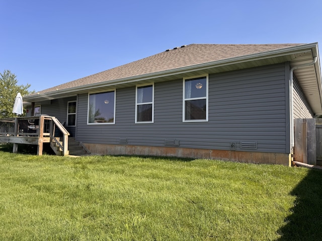 607 E Selby Dr, Nixa, MO 65714 - back of property featuring a wooden deck, a lawn, and roof with shingles