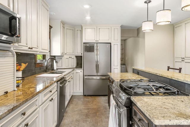 1029 Riverview Rd, Clever, MO 65631 - kitchen featuring appliances with stainless steel finishes, decorative backsplash, light stone counters, pendant lighting, and recessed lighting