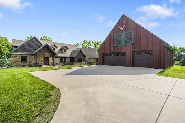 1029 Riverview Rd, Clever, MO 65631 - view of front facade featuring a barn, stone siding, a front yard, and a detached garage