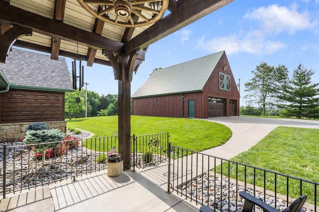 1029 Riverview Rd, Clever, MO 65631 - view of patio with a garage, an outbuilding, and a barn