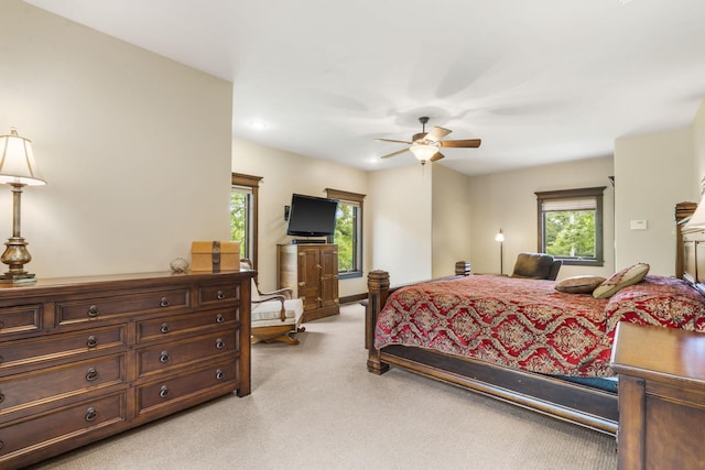1029 Riverview Rd, Clever, MO 65631 - bedroom with light carpet, multiple windows, a ceiling fan, and recessed lighting