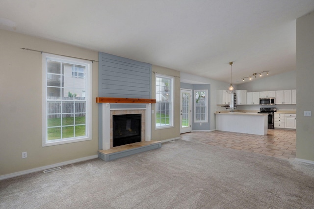713 River Rock Ct, Nixa, MO 65714 - unfurnished living room featuring light colored carpet, a large fireplace, and lofted ceiling