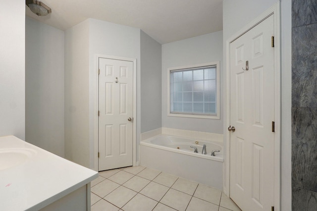 713 River Rock Ct, Nixa, MO 65714 - bathroom featuring vanity, a jetted tub, and tile patterned floors