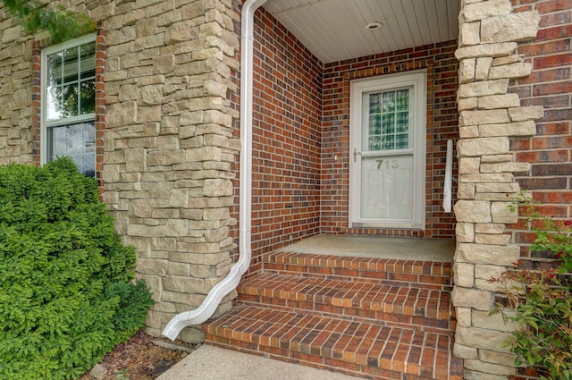 713 River Rock Ct, Nixa, MO 65714 - doorway to property featuring brick siding