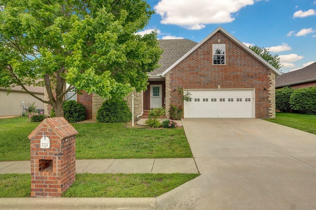 713 River Rock Ct, Nixa, MO 65714 - view of front of property with a front lawn, brick siding, a garage, and driveway