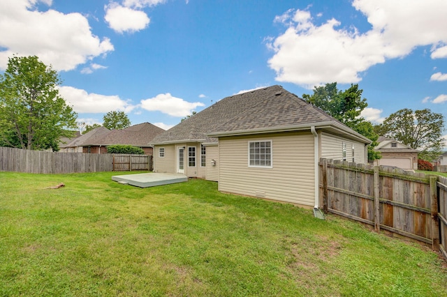 713 River Rock Ct, Nixa, MO 65714 - back of house with a fenced backyard, roof with shingles, and a wooden deck
