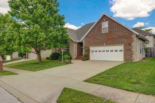 713 River Rock Ct, Nixa, MO 65714 - view of front facade featuring a front yard, driveway, brick siding, and a shingled roof