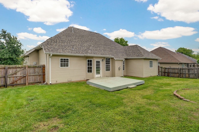 713 River Rock Ct, Nixa, MO 65714 - rear view of house featuring a fenced backyard, a deck, and a shingled roof