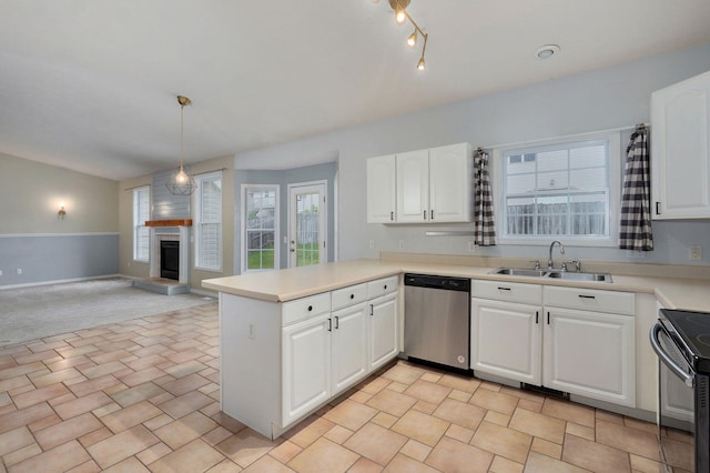 713 River Rock Ct, Nixa, MO 65714 - kitchen with stainless steel dishwasher, black electric range oven, a fireplace with raised hearth, a peninsula, and white cabinetry