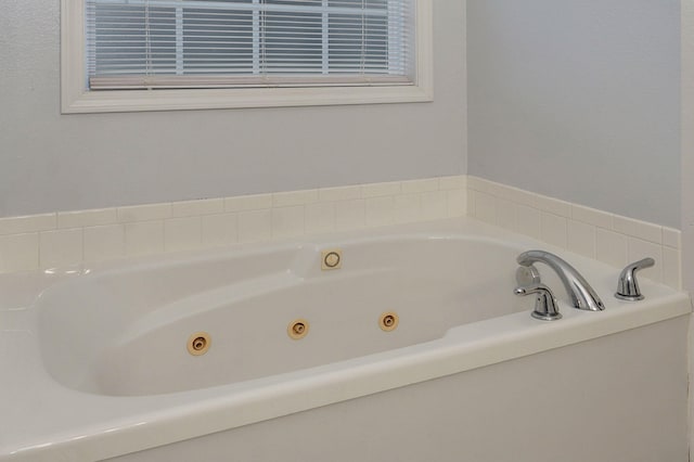 713 River Rock Ct, Nixa, MO 65714 - full bathroom featuring a tub with jets