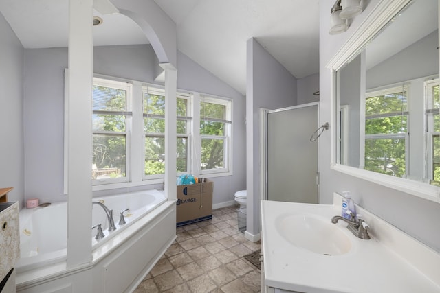 817 W Walnut St, Springfield, MO 65806 - bathroom featuring a shower stall, a bath, lofted ceiling, stone tile flooring, and vanity