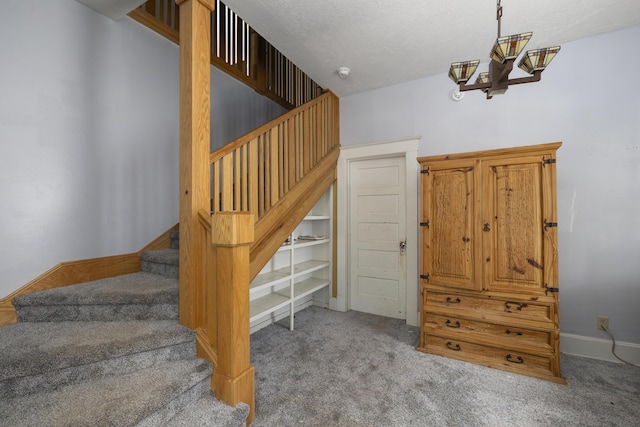 817 W Walnut St, Springfield, MO 65806 - staircase featuring carpet flooring and a chandelier