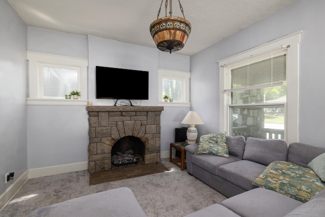 817 W Walnut St, Springfield, MO 65806 - carpeted living area with baseboards and a fireplace
