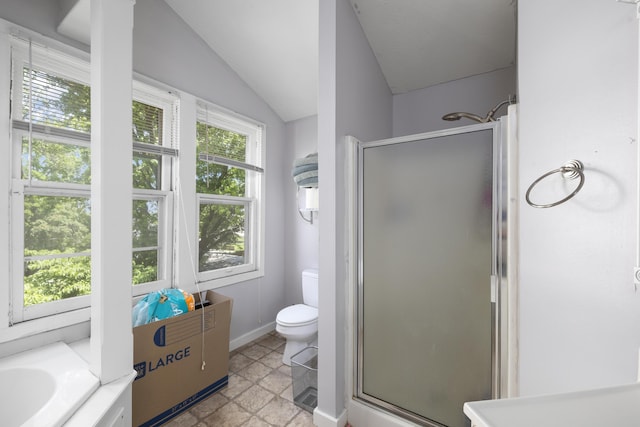 817 W Walnut St, Springfield, MO 65806 - bathroom with a stall shower, stone finish floors, lofted ceiling, and a bath