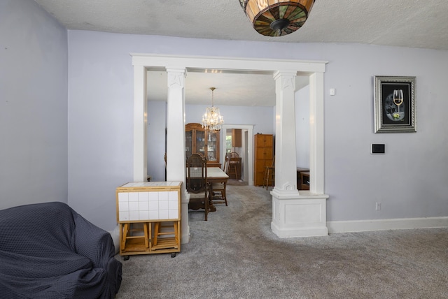 817 W Walnut St, Springfield, MO 65806 - sitting room featuring a chandelier, ornate columns, carpet, and a textured ceiling