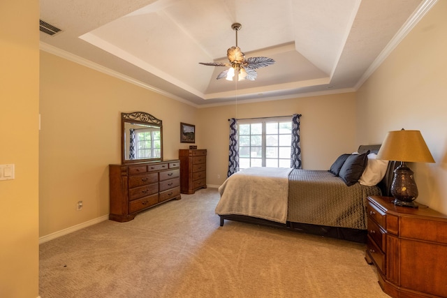 4910 S Stanton Ave, Springfield, MO 65810 - bedroom with a raised ceiling, multiple windows, light carpet, a ceiling fan, and ornamental molding