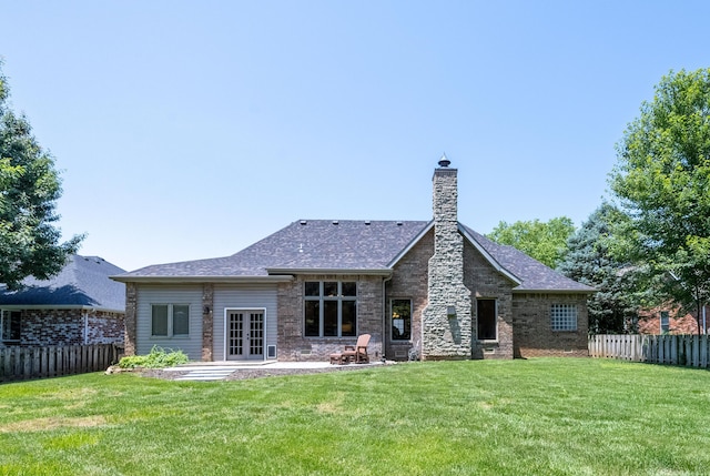 4910 S Stanton Ave, Springfield, MO 65810 - rear view of property featuring french doors, a fenced backyard, a chimney, and a patio area