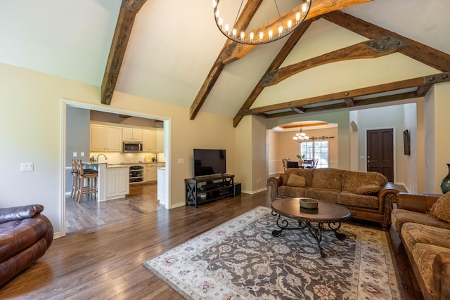 4910 S Stanton Ave, Springfield, MO 65810 - living area featuring a chandelier, arched walkways, beam ceiling, dark wood-style floors, and high vaulted ceiling