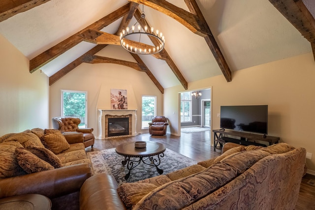 4910 S Stanton Ave, Springfield, MO 65810 - living room with a chandelier, beam ceiling, dark wood-type flooring, high vaulted ceiling, and a high end fireplace