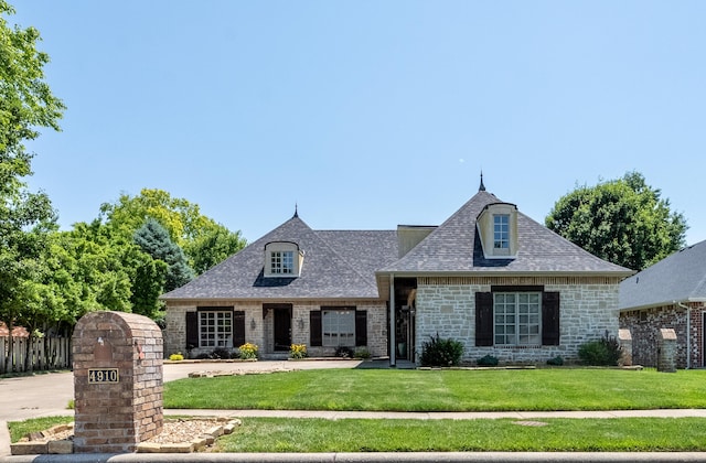 4910 S Stanton Ave, Springfield, MO 65810 - french country style house featuring stone siding and a shingled roof