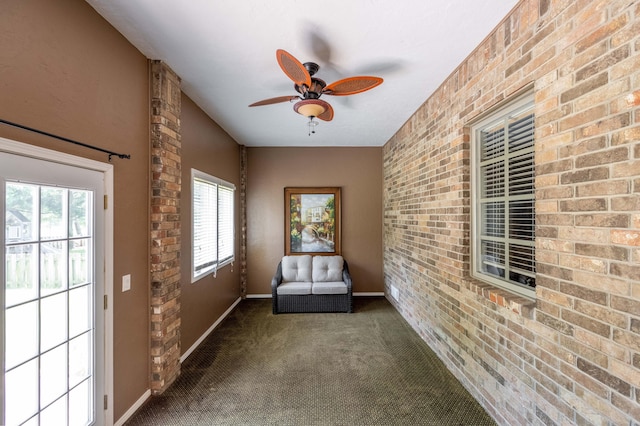 4910 S Stanton Ave, Springfield, MO 65810 - unfurnished room with carpet flooring, a ceiling fan, and brick wall