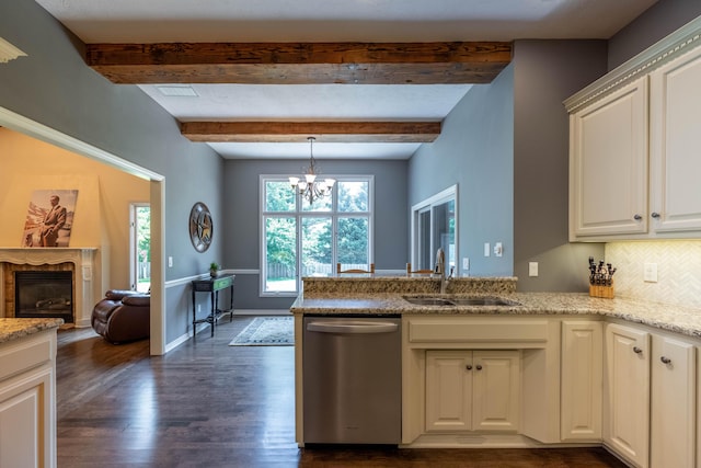 4910 S Stanton Ave, Springfield, MO 65810 - kitchen with dishwasher, dark wood-style flooring, a peninsula, a glass covered fireplace, and beamed ceiling