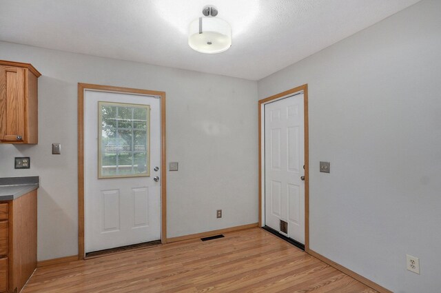 1651 S Mahn Ct, Springfield, MO 65802 - entryway featuring light wood-type flooring and baseboards