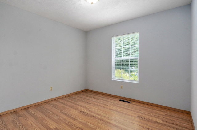1651 S Mahn Ct, Springfield, MO 65802 - empty room with light wood-style floors and baseboards