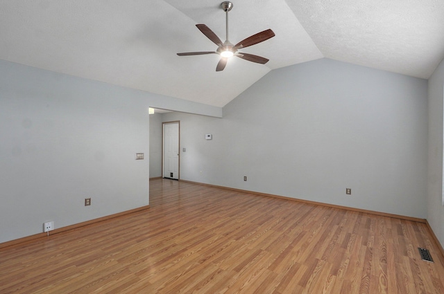 1651 S Mahn Ct, Springfield, MO 65802 - spare room featuring a ceiling fan, vaulted ceiling, and light wood-type flooring