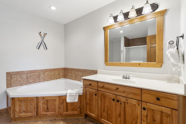 76 Bells Ave Unit 98, Branson West, MO 65737 - bathroom featuring vanity, a garden tub, a shower stall, tile patterned flooring, and recessed lighting