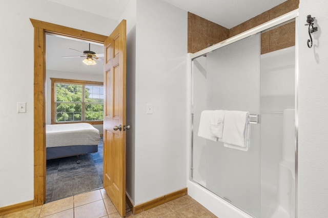 76 Bells Ave Unit 98, Branson West, MO 65737 - ensuite bathroom featuring a stall shower, ceiling fan, and tile patterned floors