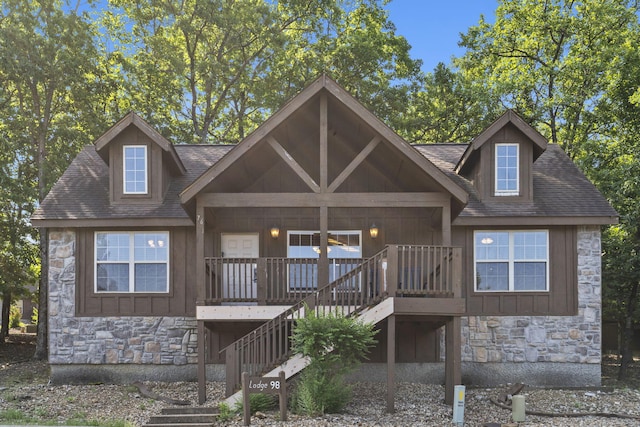 76 Bells Ave Unit 98, Branson West, MO 65737 - view of front of property featuring stone siding, board and batten siding, stairs, and roof with shingles