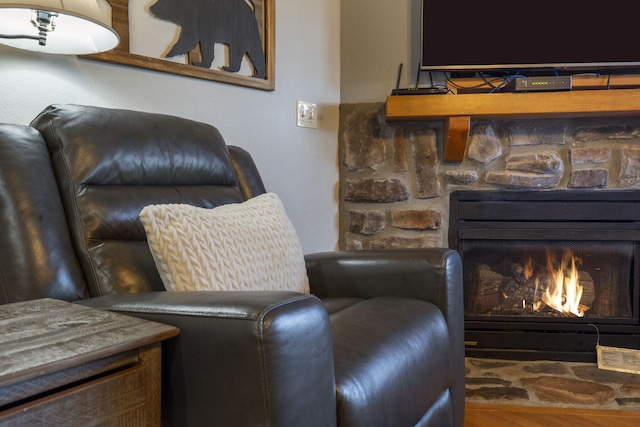 76 Bells Ave Unit 98, Branson West, MO 65737 - sitting room with a stone fireplace and wood finished floors