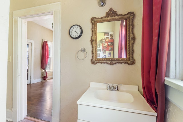 1123 W Hovey St, Springfield, MO 65802 - bathroom with vanity and wood finished floors