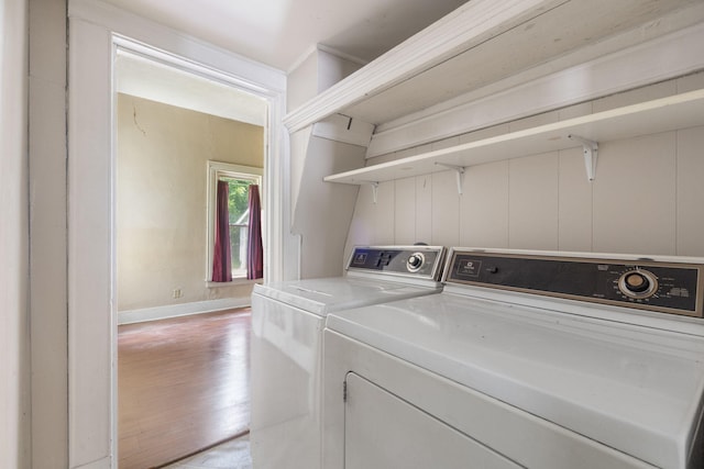 1123 W Hovey St, Springfield, MO 65802 - laundry area featuring light wood-style flooring and washing machine and dryer