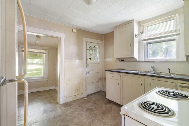 1123 W Hovey St, Springfield, MO 65802 - kitchen with white appliances, dark countertops, and cream cabinetry