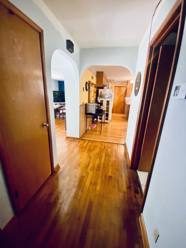 513 Meng St, Greenfield, MO 65661 - corridor featuring arched walkways and wood-type flooring