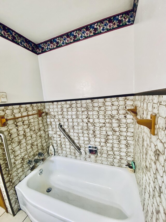 513 Meng St, Greenfield, MO 65661 - bathroom featuring a tub to relax in and tile patterned floors