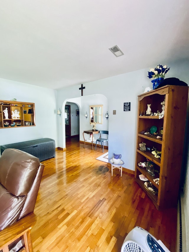 513 Meng St, Greenfield, MO 65661 - living area with arched walkways and light wood-type flooring