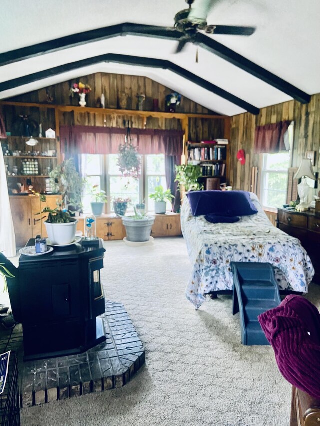 513 Meng St, Greenfield, MO 65661 - bedroom featuring carpet floors, lofted ceiling, a wood stove, and wooden walls