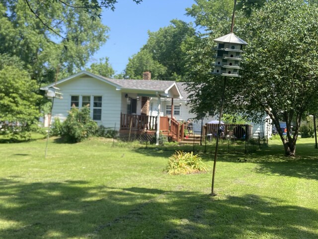 513 Meng St, Greenfield, MO 65661 - view of front of house with a front lawn and a chimney