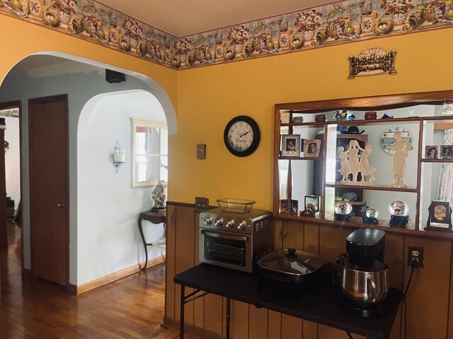 513 Meng St, Greenfield, MO 65661 - dining area featuring arched walkways and wood finished floors