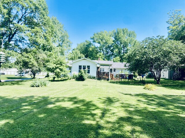 513 Meng St, Greenfield, MO 65661 - view of green lawn with a deck