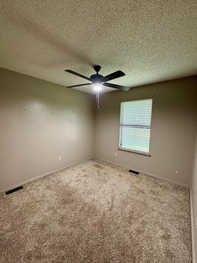 701 Barracuda Dr, Nixa, MO 65714 - empty room featuring carpet floors, a ceiling fan, and a textured ceiling