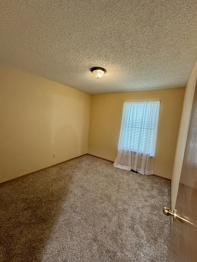 701 Barracuda Dr, Nixa, MO 65714 - carpeted empty room featuring a textured ceiling and baseboards