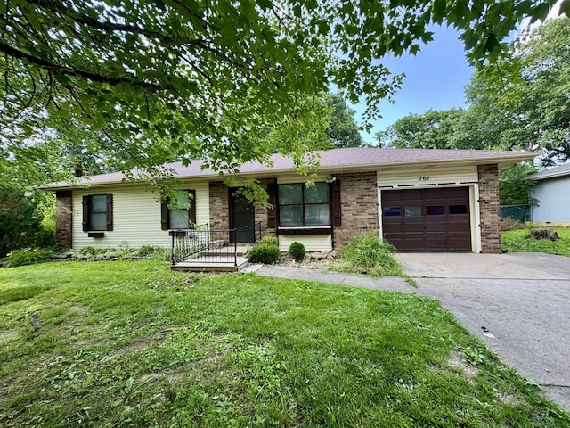 701 Barracuda Dr, Nixa, MO 65714 - ranch-style house featuring a garage, driveway, a front lawn, and brick siding