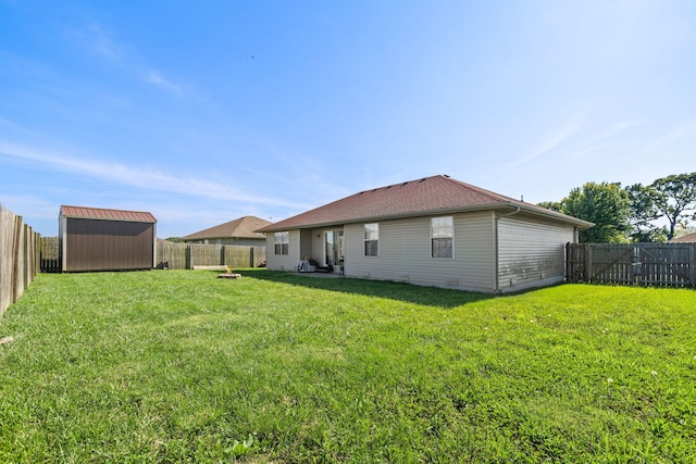 208 Dixie Ave, Clever, MO 65631 - rear view of house with a fenced backyard and a shed